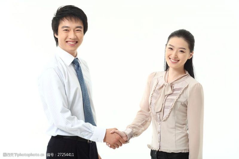 商务人士握手微笑的商务男女图片